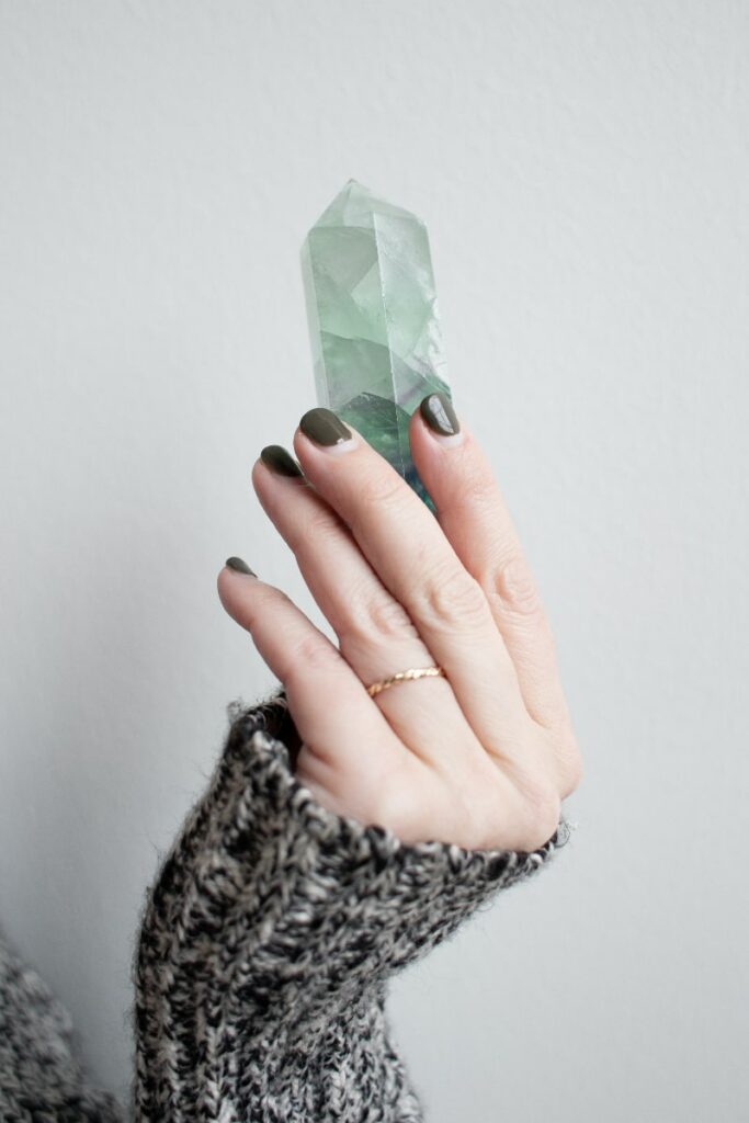 hand holding crystal protection for empaths